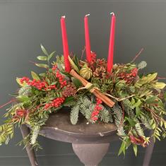 Red candle Christmas table arrangement 