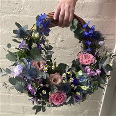 Floral wreath with pine base 